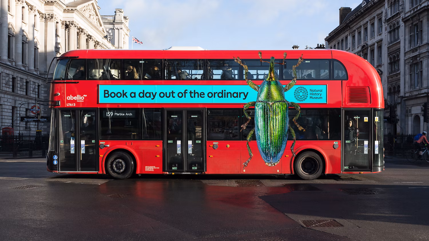 Natural history branding on the side of a red double decker bus in London